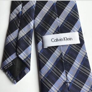 Calvin Klein blue  with navy stripes  all Silk  tie